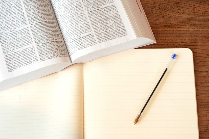 Top View of Open Book and Notebook